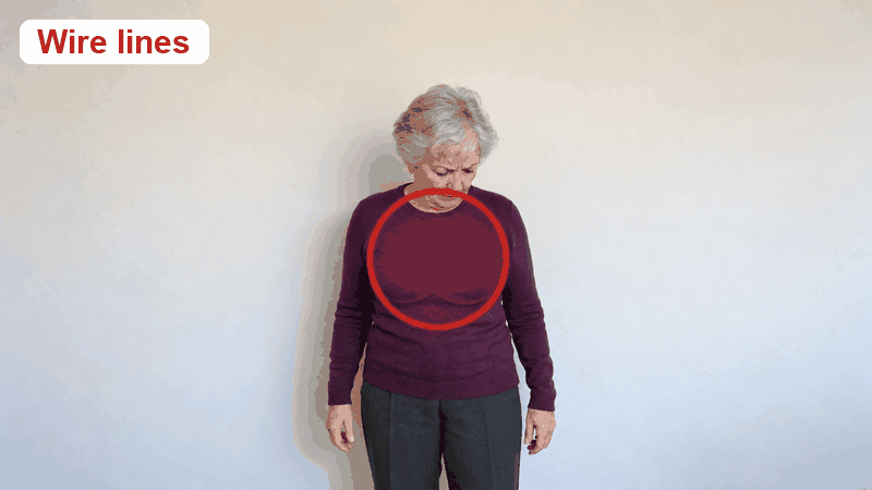 Wire lines show through a fitted plum sweater; with the tank the knit lies smooth