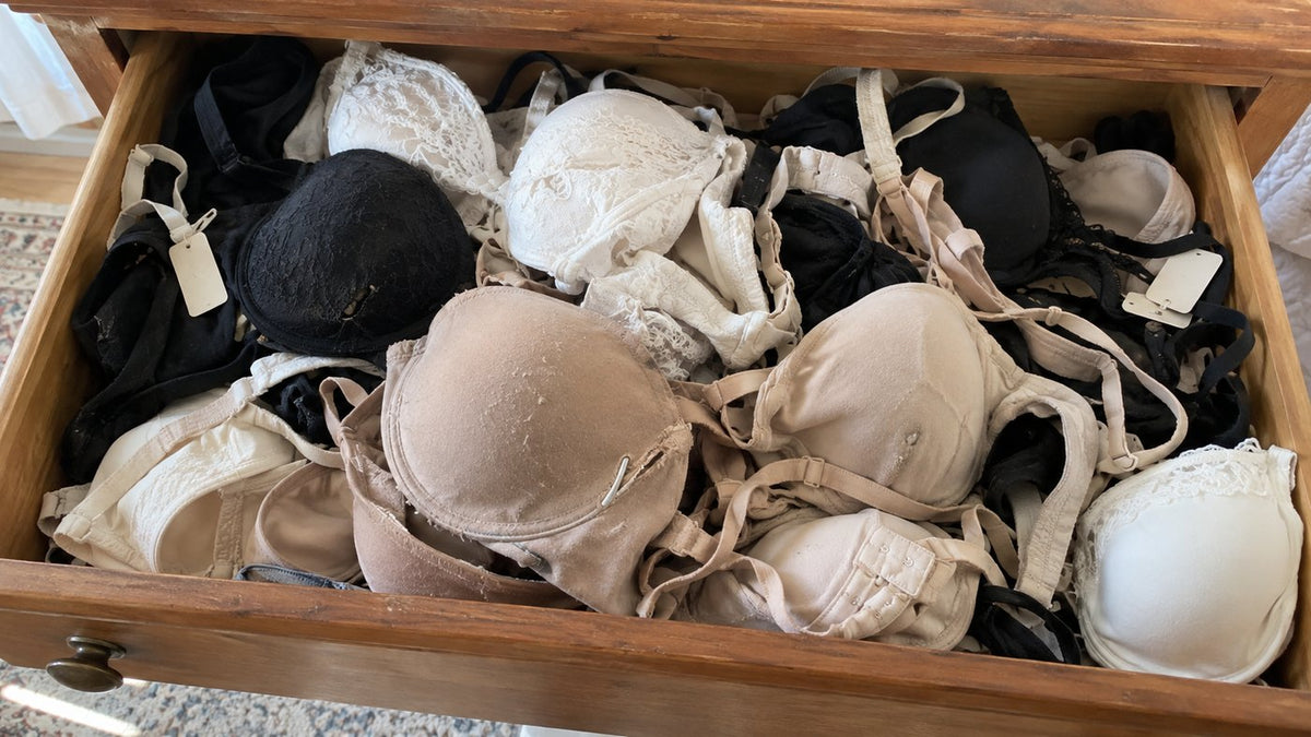 A drawer full of bras, most of them worn once